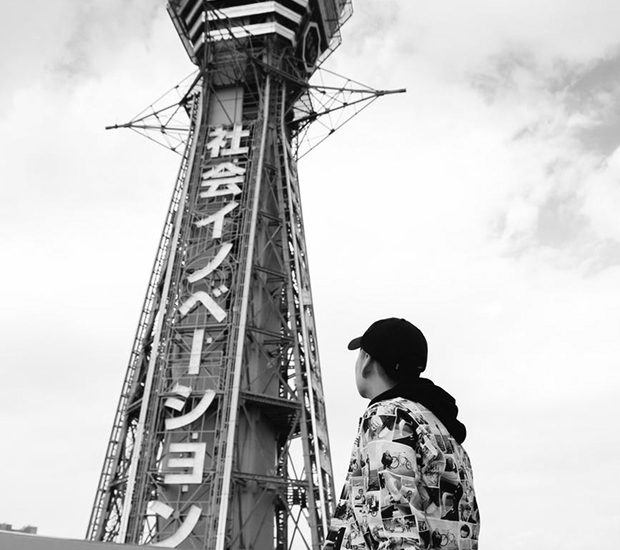 a person is looking up the tower